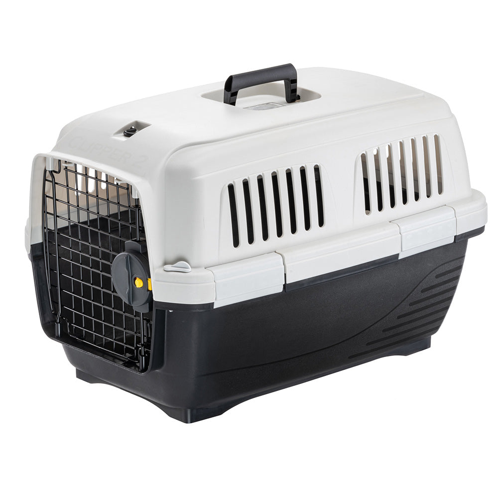 Caisse de transport pour animaux, plastique robuste, porte grillagée, poignée ergonomique, idéale pour chats et petits chiens, voyage sécurisé.